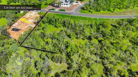 a view of a yard with a lake view