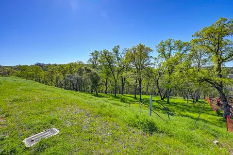 a backyard of a house with lots of green space