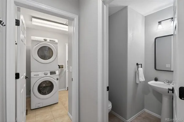 a utility room with sink washer and dryer