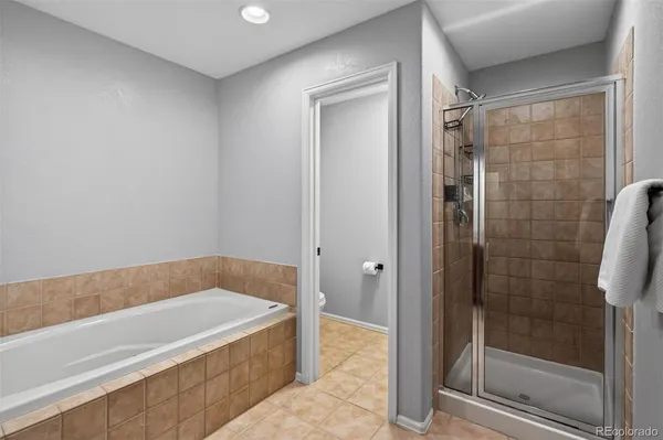 a bathroom with a bathtub and shower