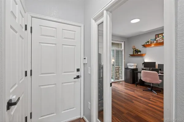 a room with furniture and wooden floor