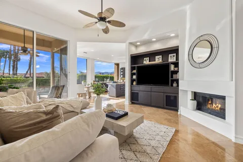 a view of a swimming pool with a table and chairs