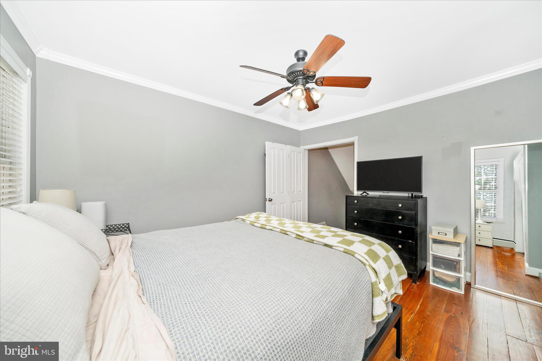 313 North Market Street Frederick, MD 21701 - Photo 19 of 40 a bedroom with a bed and a flat screen tv