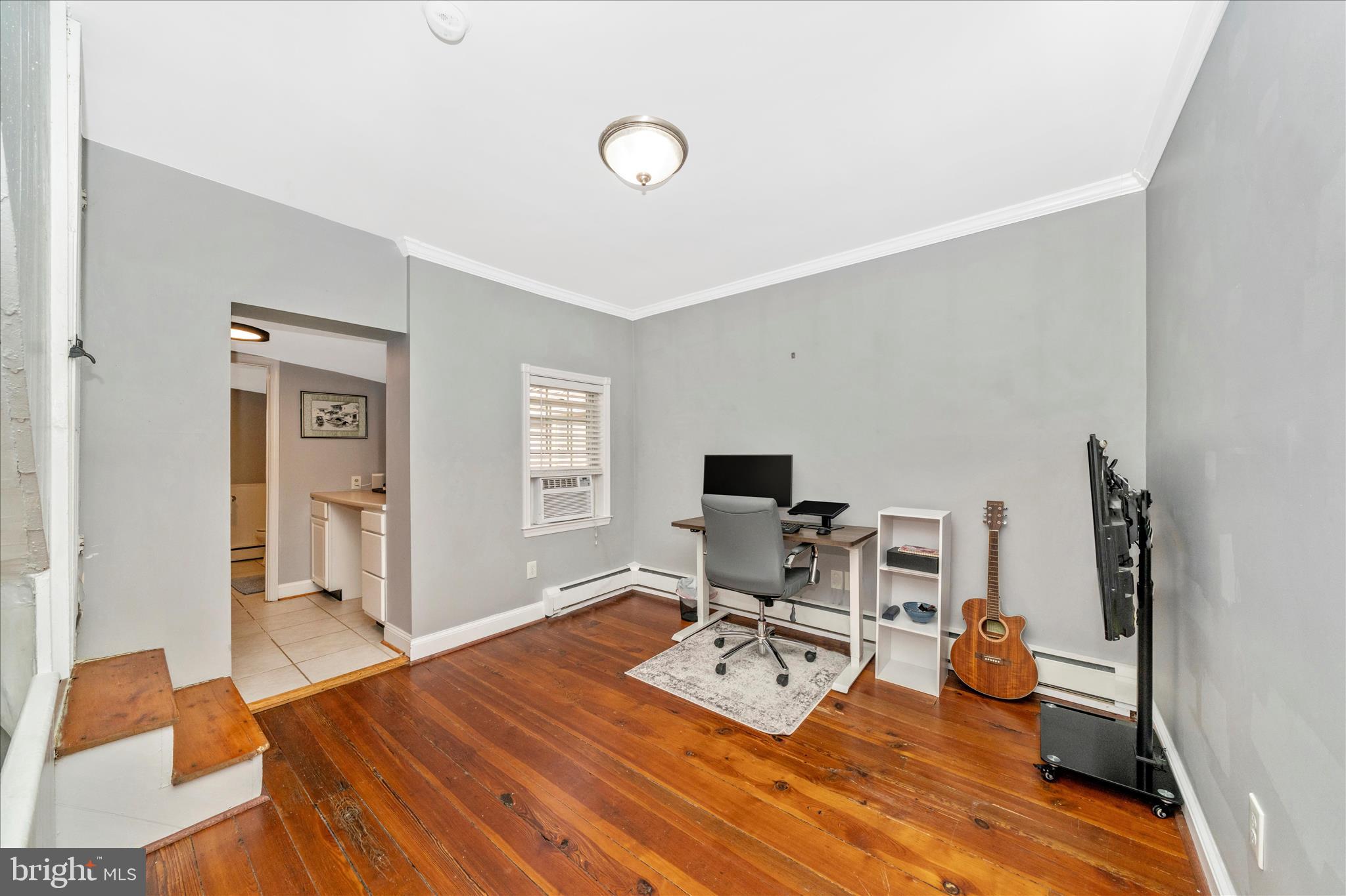 313 North Market Street Frederick, MD 21701 - Photo 21 of 40 a view of a workspace with furniture and a window