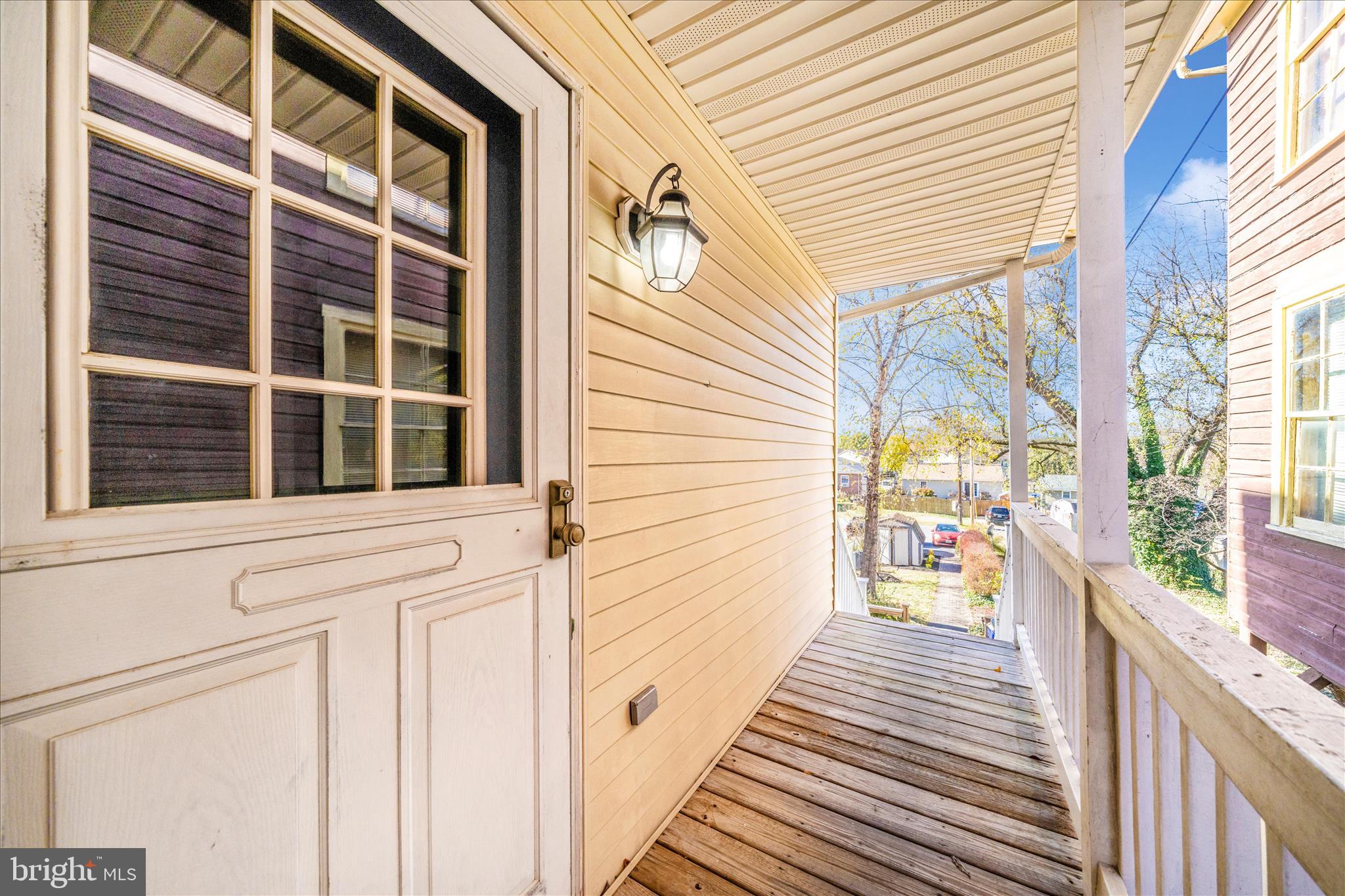 313 North Market Street Frederick, MD 21701 - Photo 30 of 40 a view of a balcony with wooden floor and fence