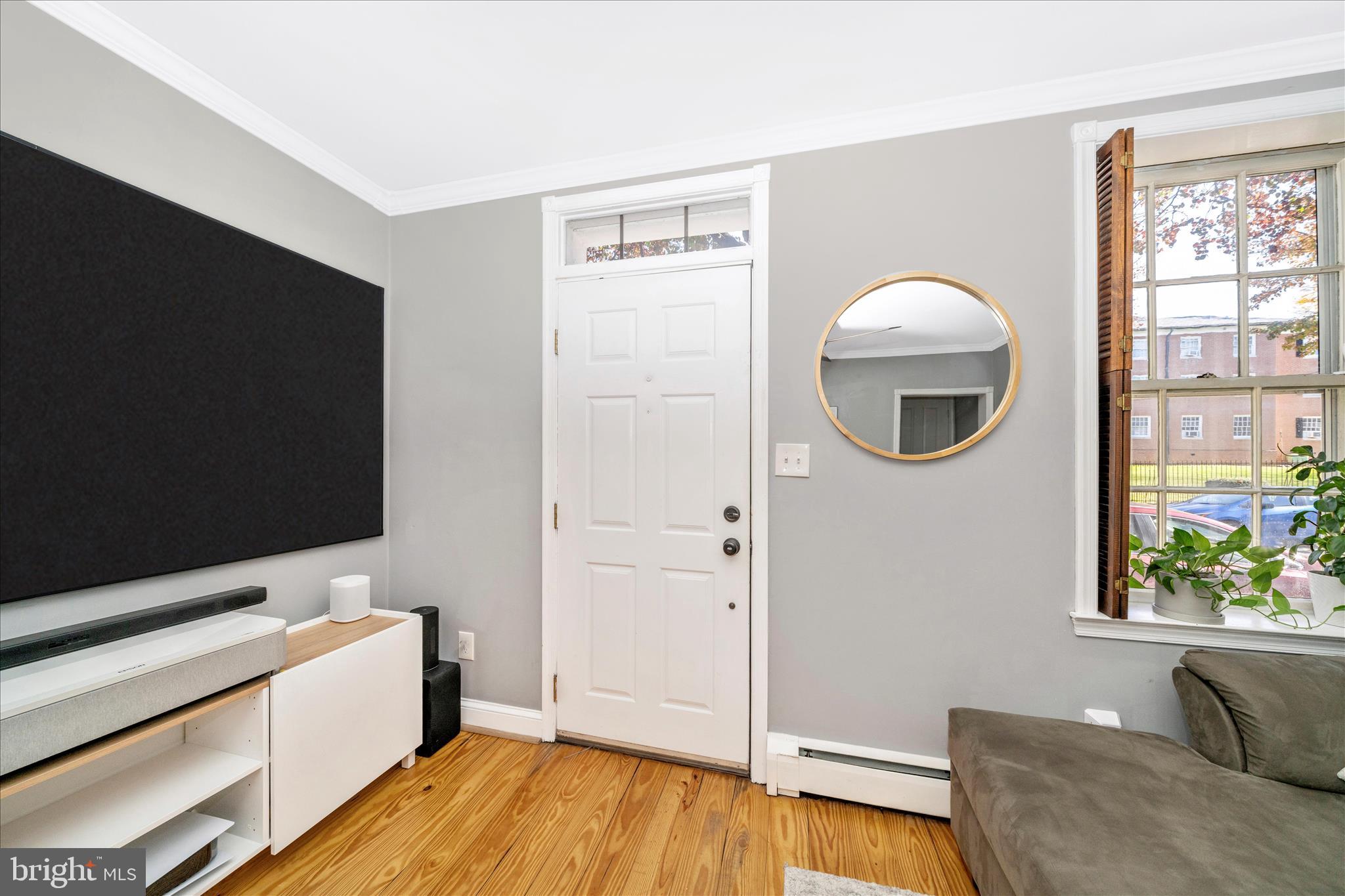 313 North Market Street Frederick, MD 21701 - Photo 3 of 40 a view of livingroom with furniture and a flat screen tv