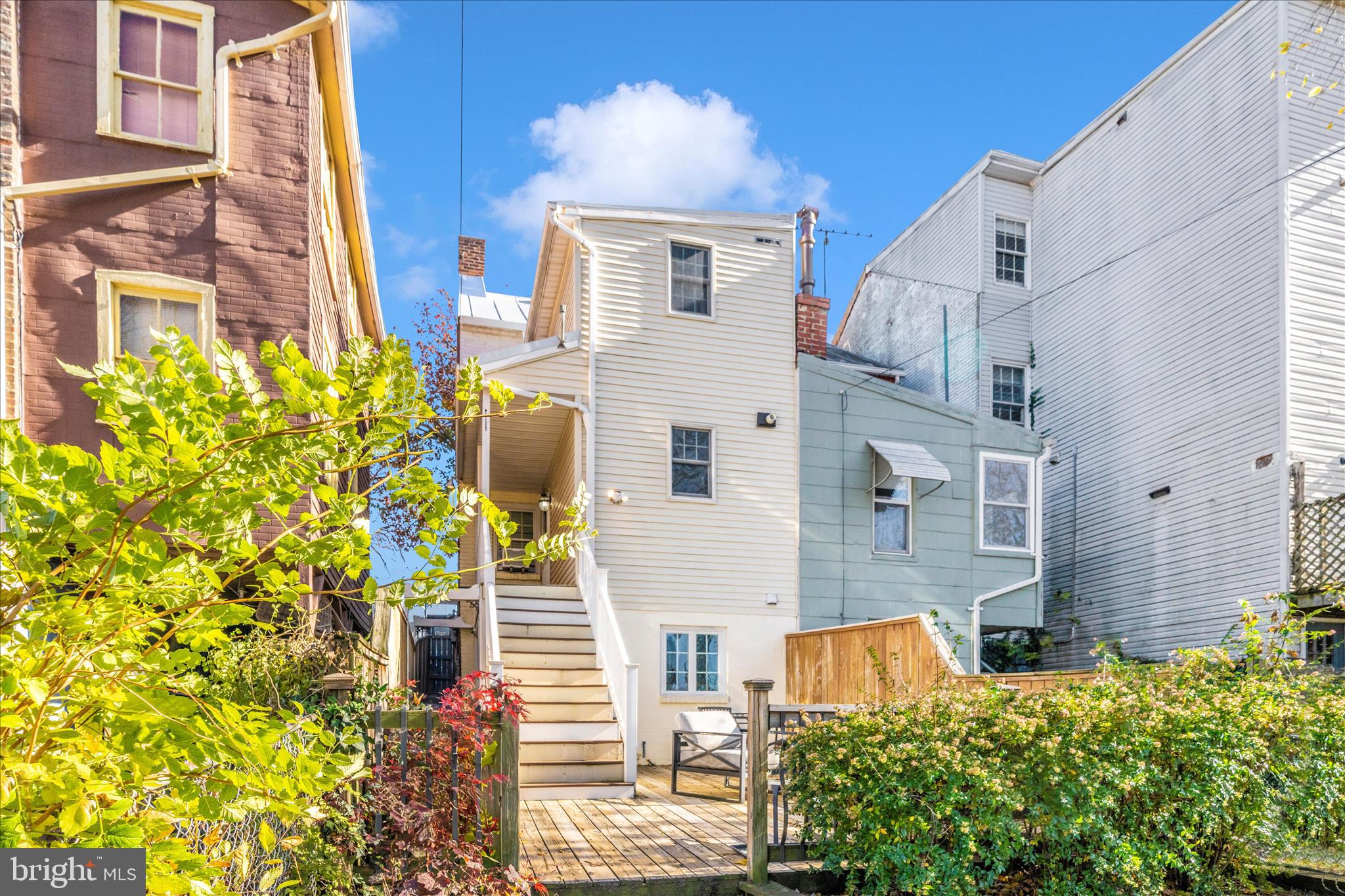 313 North Market Street Frederick, MD 21701 - Photo 33 of 40 front view of a brick house with a yard