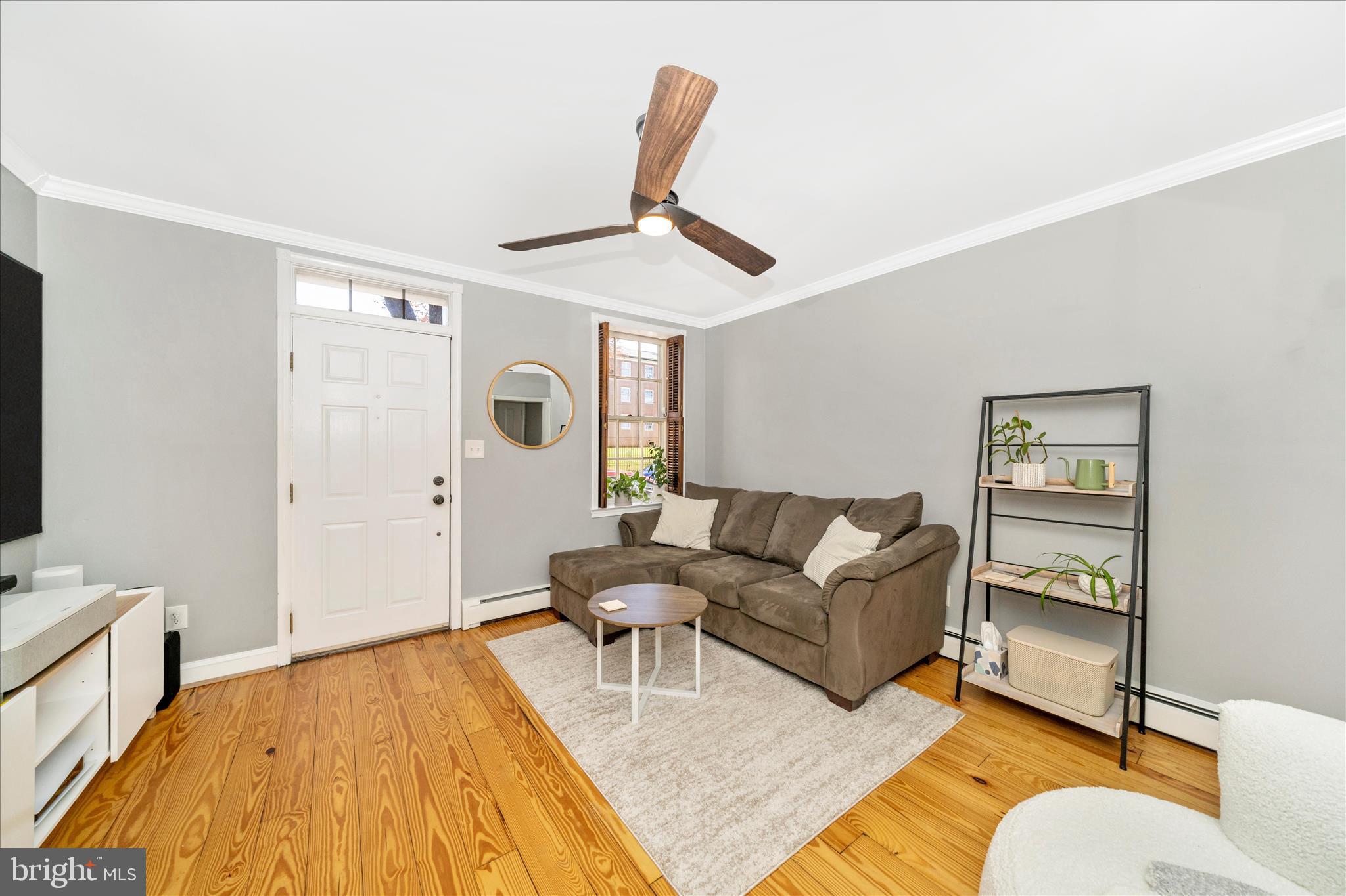 313 North Market Street Frederick, MD 21701 - Photo 5 of 40 a living room with furniture and a flat screen tv