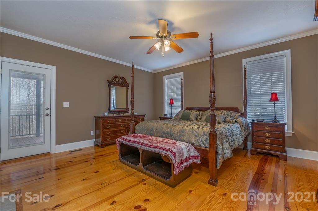 137 Green Pastures Drive Rutherfordton, NC 28139 - Photo 14 of 35 a bedroom with a bed and wooden floor
