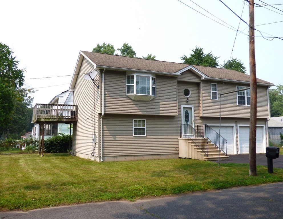 6 Devonshire Road Springfield, MA 01109 - Photo 15 of 23 a front view of a house with garden