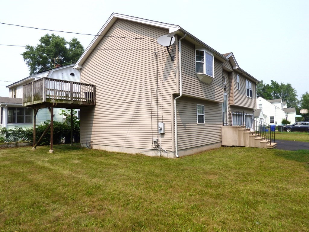 6 Devonshire Road Springfield, MA 01109 - Photo 2 of 23 a view of a house with a yard