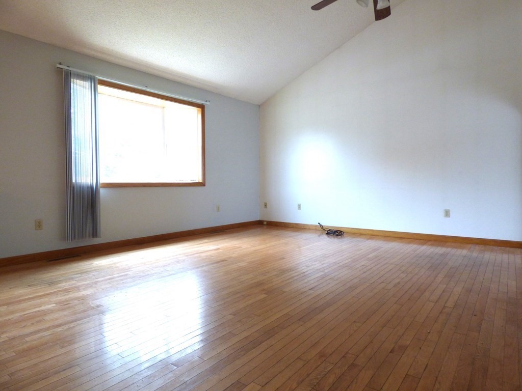 6 Devonshire Road Springfield, MA 01109 - Photo 21 of 23 an empty room with wooden floor and windows