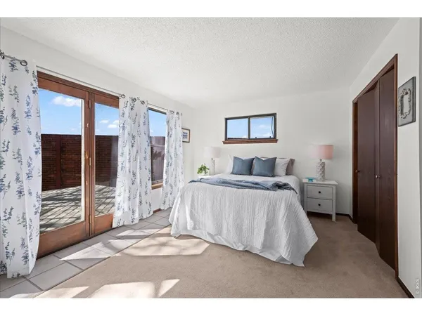 a bedroom with a bed and a walk in closet