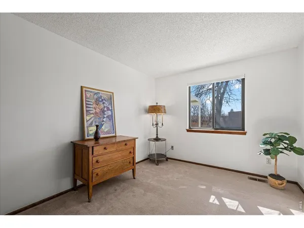 a workspace with furniture and window