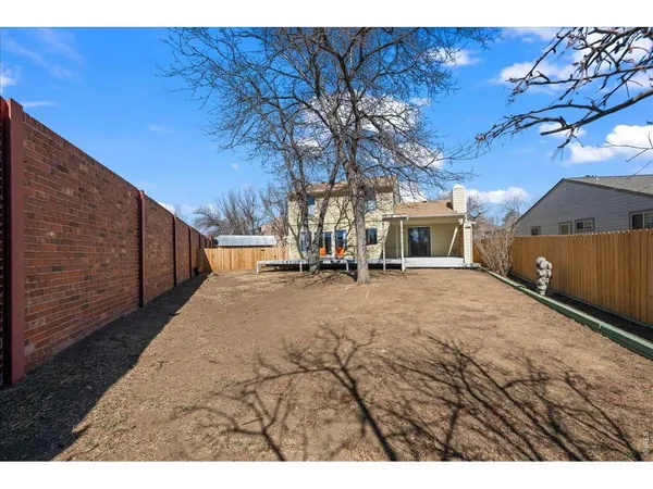 a view of a backyard of the house