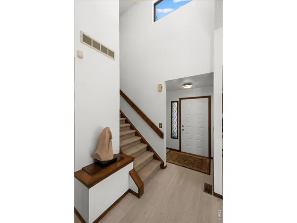 a view of a hallway with staircase