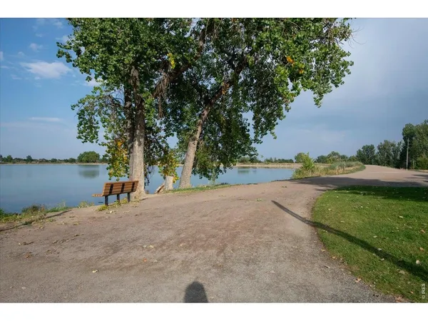 a view of a lake with houses in the background