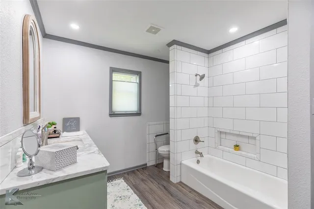 a bathroom with a bathtub and a sink