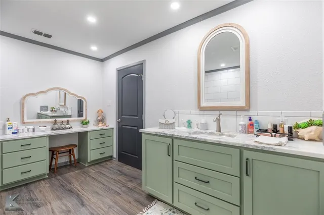 a bathroom with a double vanity sink and a mirror