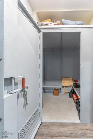 a room with a wooden floor and shoes