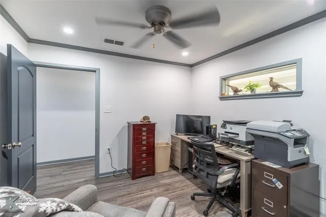 a view of a workspace with furniture