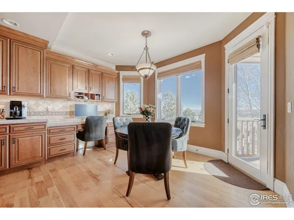 a workspace with furniture bookshelf and a window