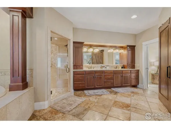 a bathroom with a granite countertop sink mirror and double