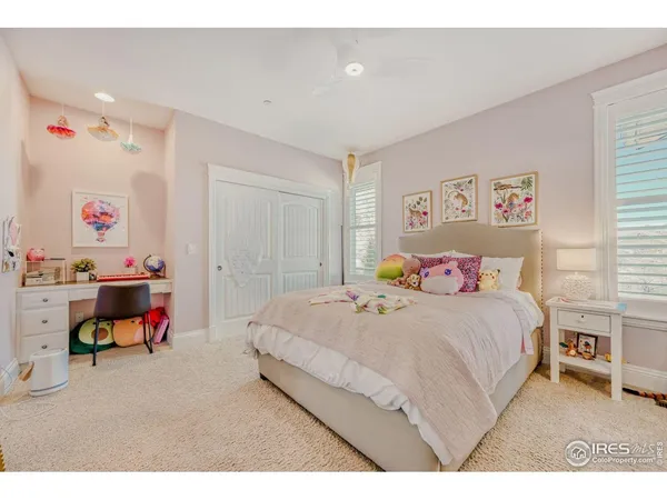 a bedroom with a bed and a mirror