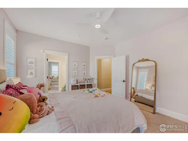 a spacious bathroom with a granite countertop sink and a mirror