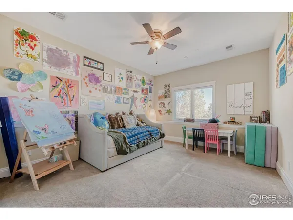 a bedroom with a bed and a couch