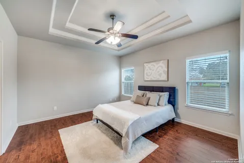 a bedroom with a large bed and a large window