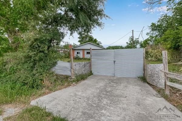 14317 Murray Road Houston, TX 77044 - Photo 2 of 8 a view of a house with a small yard and large tree