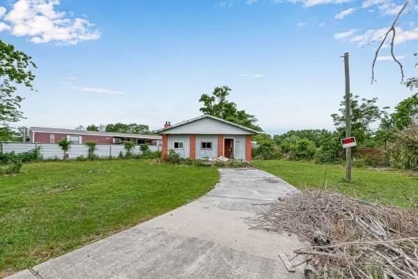14317 Murray Road Houston, TX 77044 - Photo 3 of 8 a view of house with garden and trees