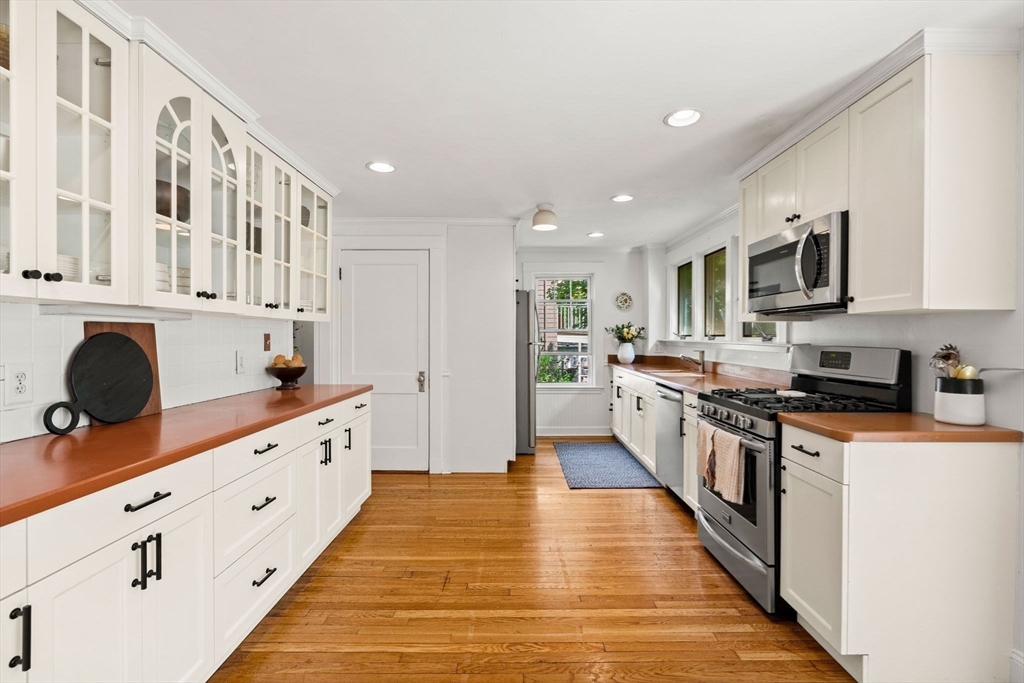 34 Avalon Road Milton, MA 02186 - Photo 16 of 42 a large kitchen with stainless steel appliances granite countertop a lot of counter space and wooden floors
