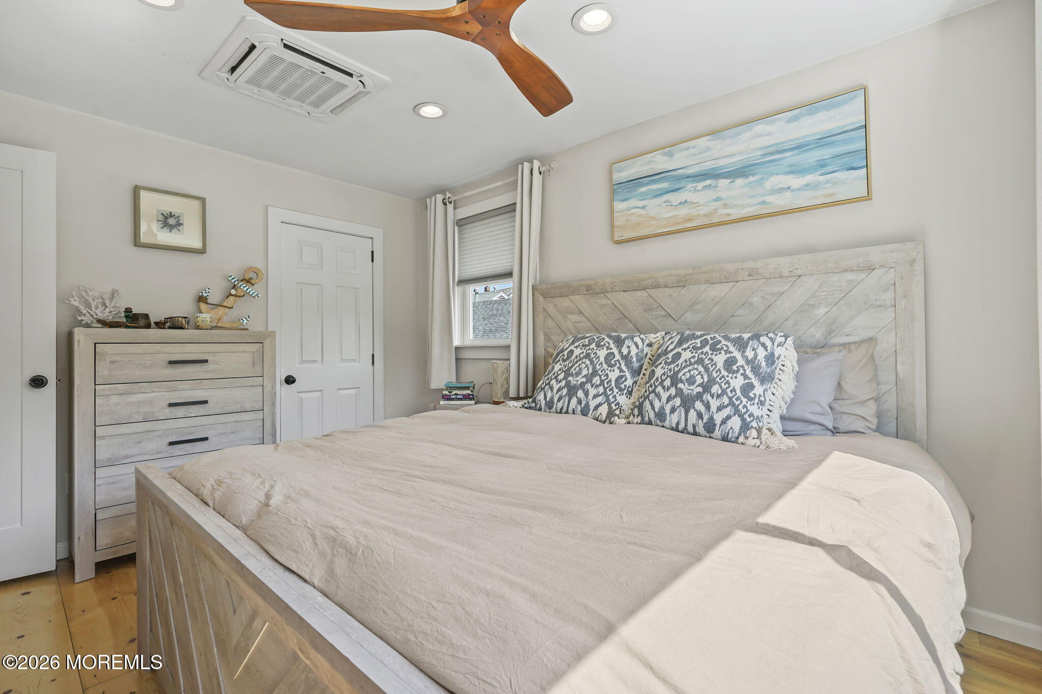 30 2nd Street Highlands, NJ 07732 - Photo 12 of 29 a bedroom with a bed and a painting on the wall