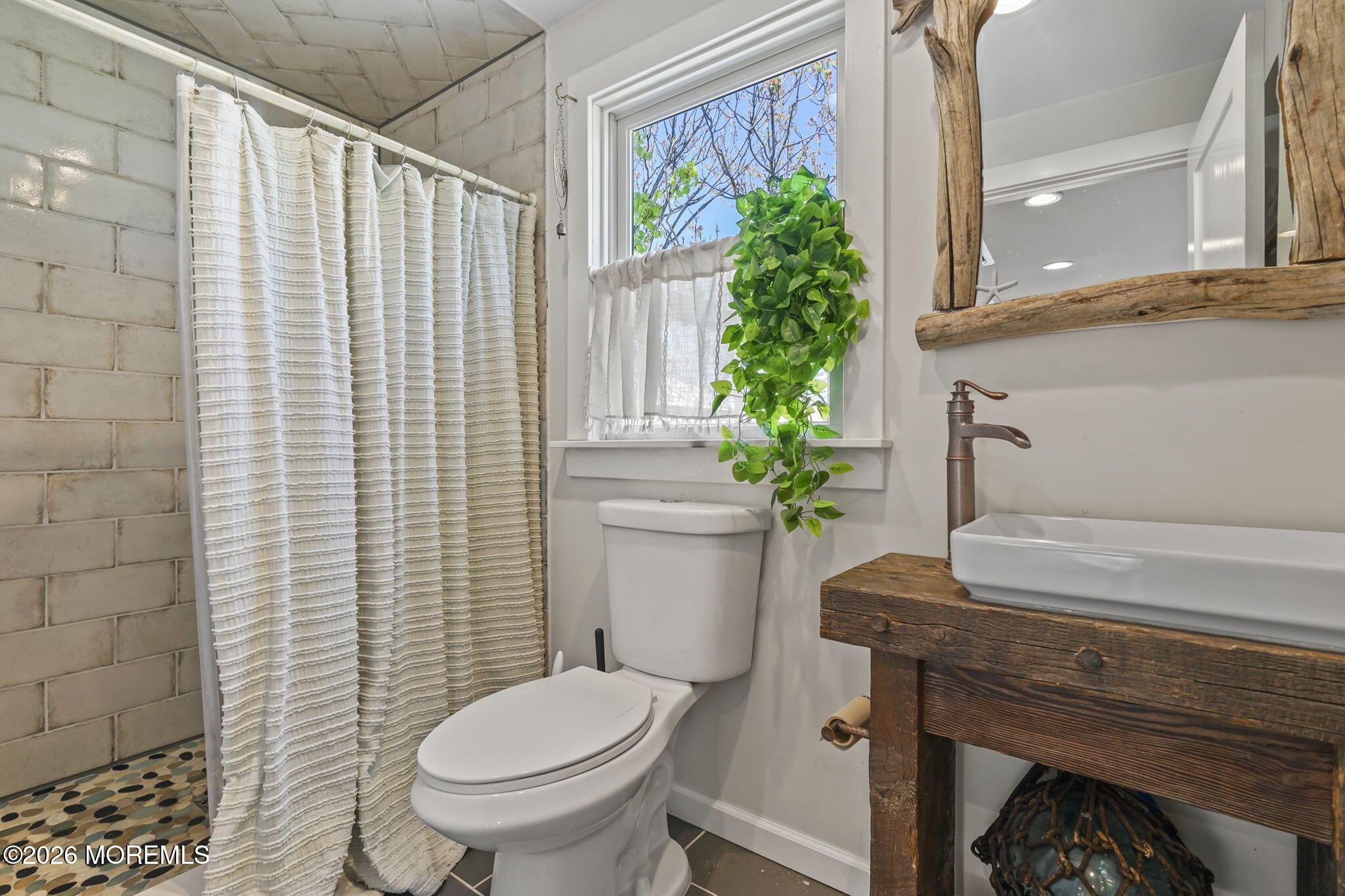 30 2nd Street Highlands, NJ 07732 - Photo 13 of 29 a bathroom with a toilet and a shower