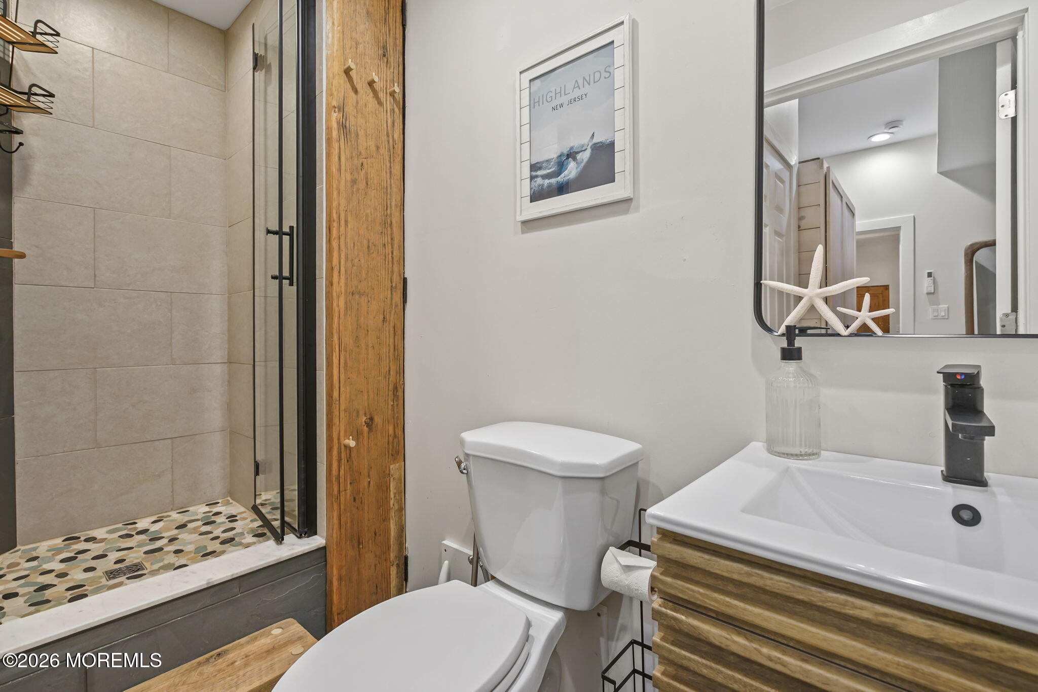 30 2nd Street Highlands, NJ 07732 - Photo 16 of 29 a bathroom with a sink a toilet and shower