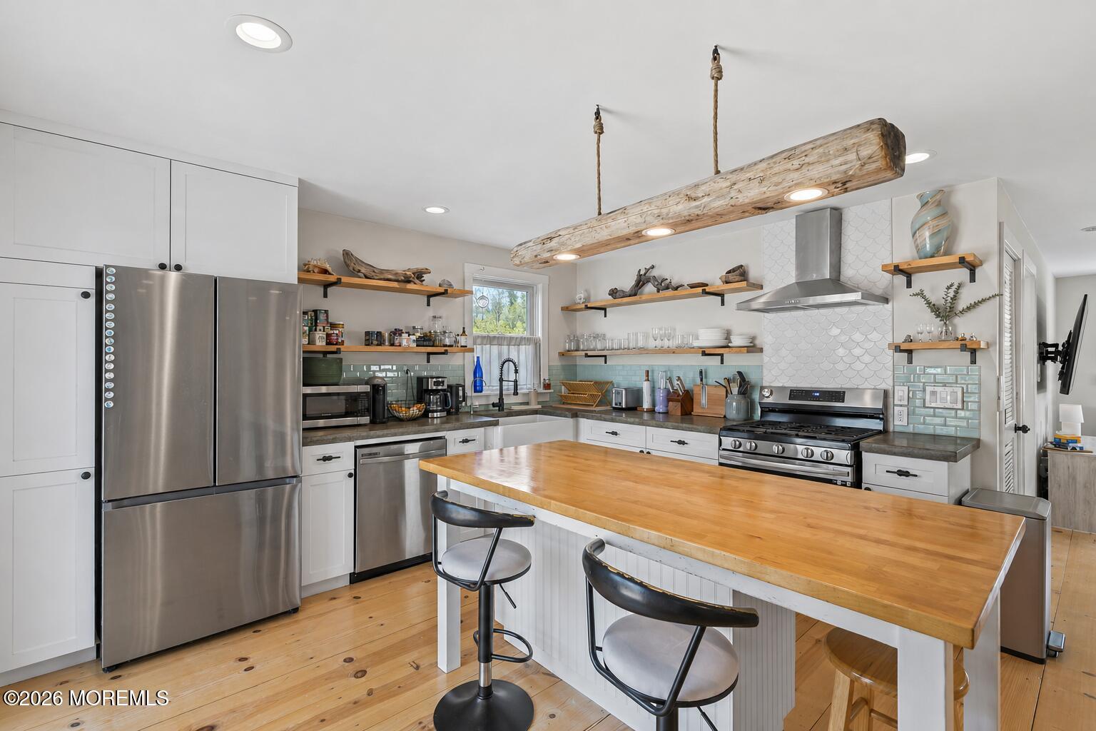 30 2nd Street Highlands, NJ 07732 - Photo 8 of 29 a kitchen with stainless steel appliances granite countertop a refrigerator a sink dishwasher a stove and a refrigerator with wooden floor