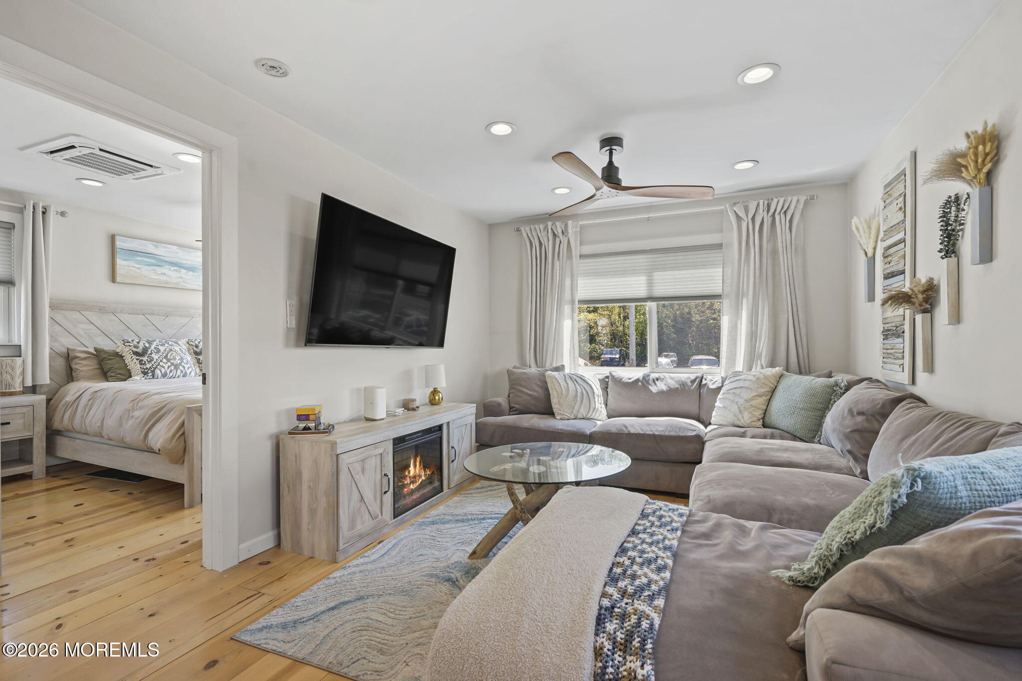 30 2nd Street Highlands, NJ 07732 - Photo 9 of 29 a living room with furniture and a flat screen tv