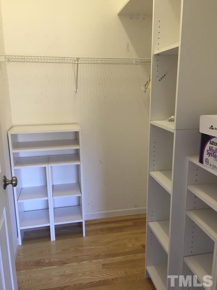 1150 Robertson Road Roxboro, NC 27574 - Photo 11 of 21 a view of walk in closet with empty racks