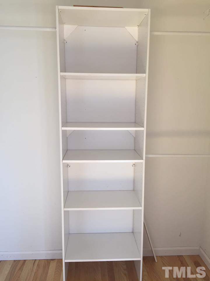 1150 Robertson Road Roxboro, NC 27574 - Photo 13 of 21 a view of walk in closet with empty racks