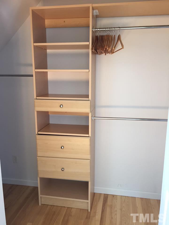 1150 Robertson Road Roxboro, NC 27574 - Photo 15 of 21 a view of walk in closet with empty racks