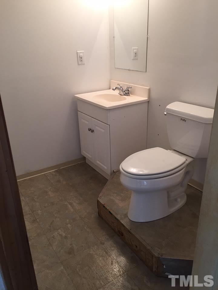 1150 Robertson Road Roxboro, NC 27574 - Photo 21 of 21 a bathroom with a sink and toilet