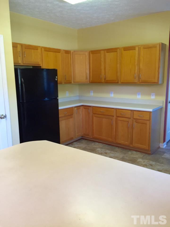 1150 Robertson Road Roxboro, NC 27574 - Photo 4 of 21 a kitchen with a sink and cabinets