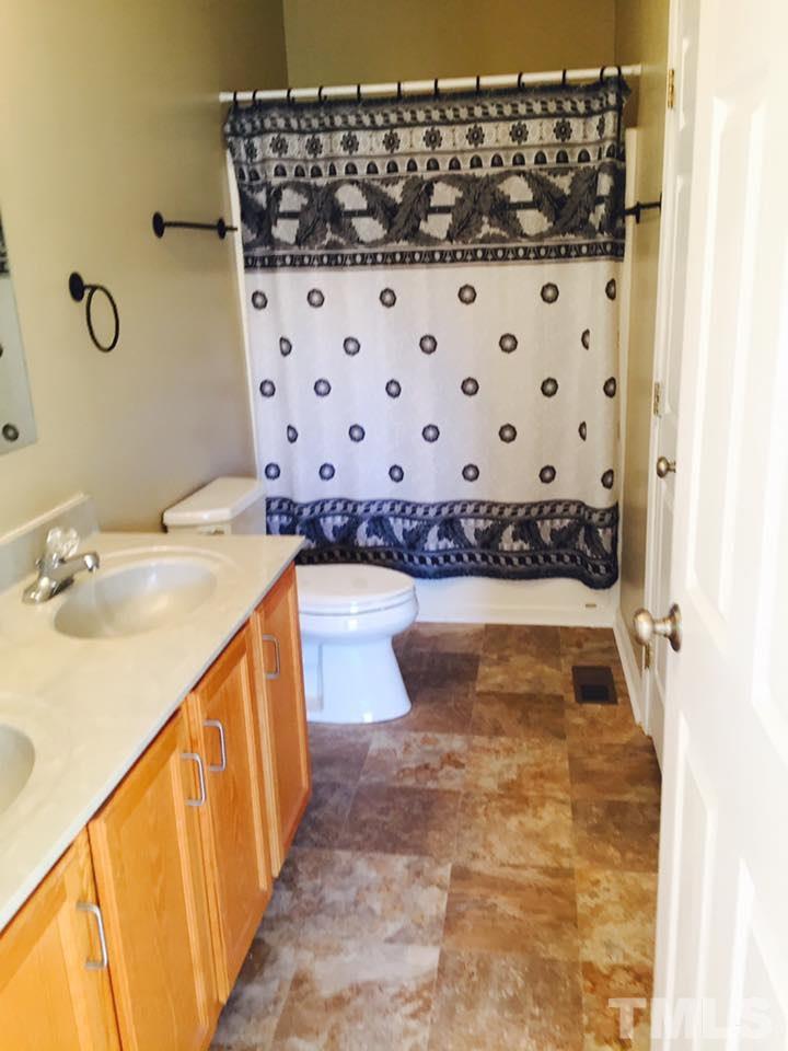 1150 Robertson Road Roxboro, NC 27574 - Photo 9 of 21 a bathroom with a sink and a mirror