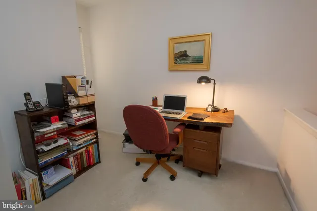 a view of a workspace with furniture