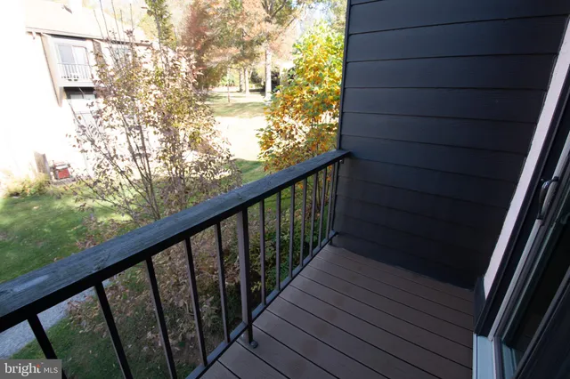 a view of balcony with wooden floor