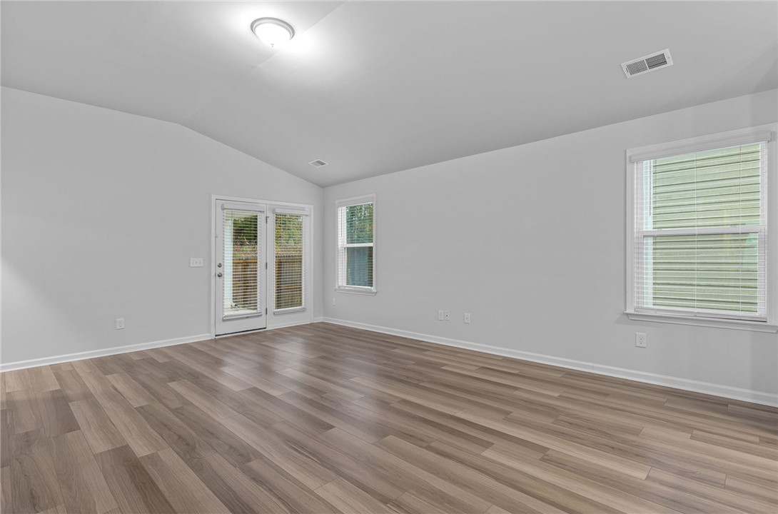 24 Chalet Court Anderson, SC 29621 - Photo 13 of 39 This airy room features durable flooring, offering a versatile space for living or dining.