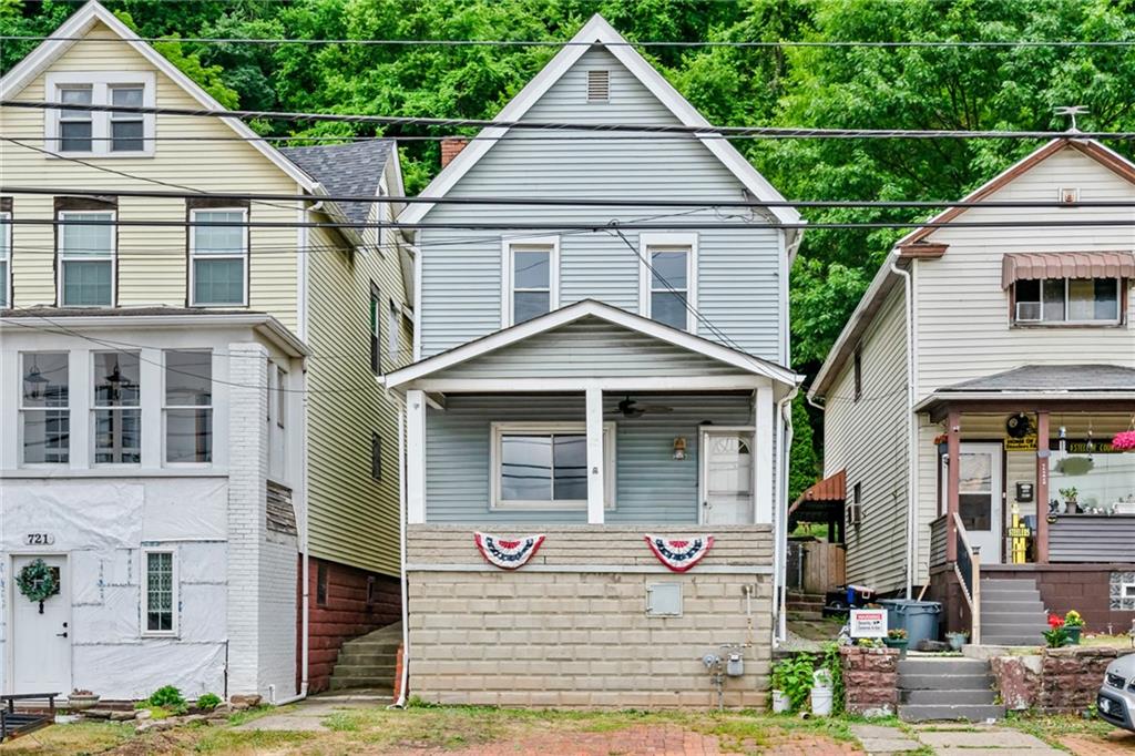 723 Freeport Road Creighton, PA 15030 - Photo 1 of 27 a front view of a house with garden
