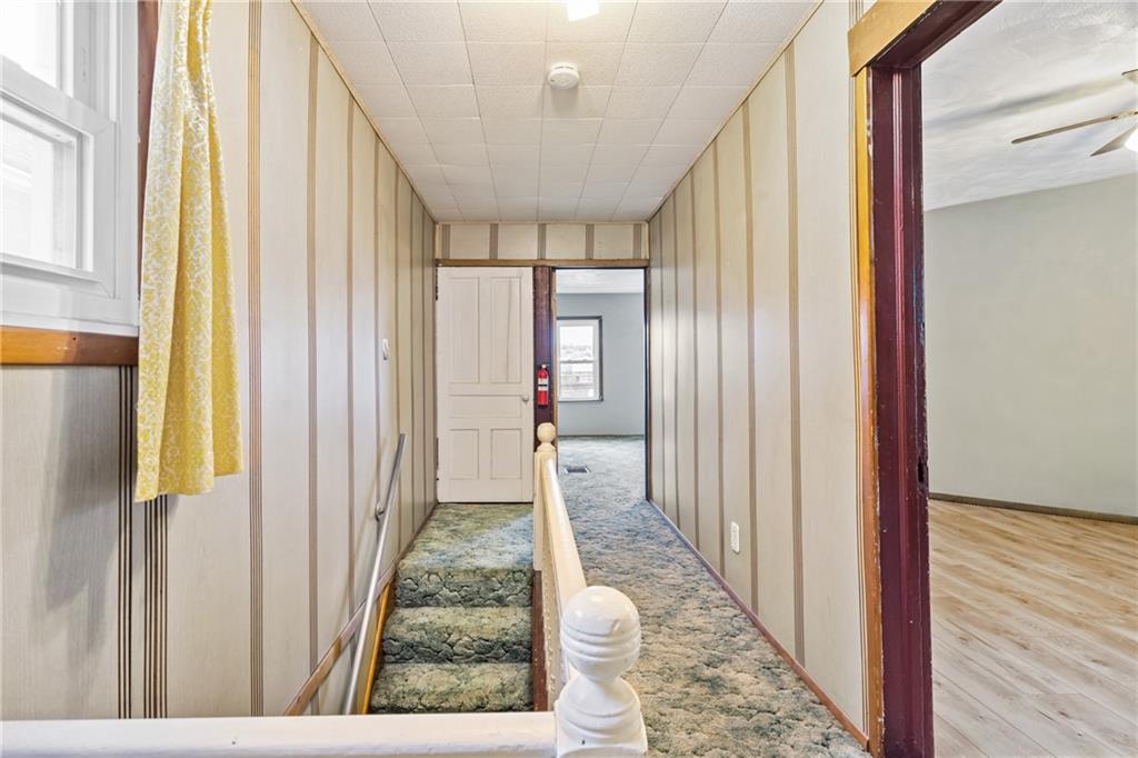 723 Freeport Road Creighton, PA 15030 - Photo 13 of 27 a view of a hallway with wooden floor and staircase